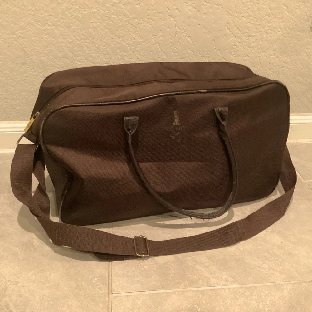 Paco Rabanne Brown Duffel Bag with Structured Design and Top Handles